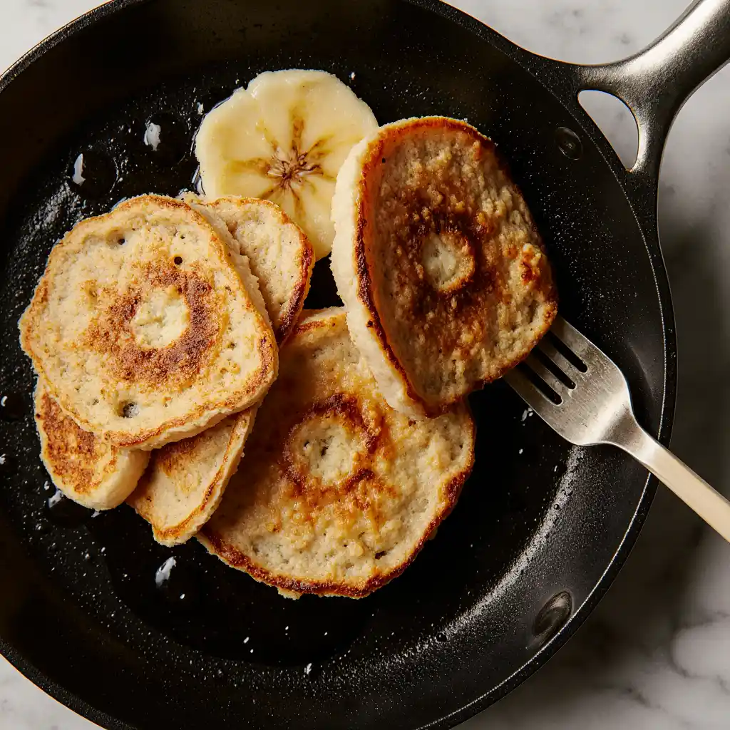 Cooking banana pancakes in a pan